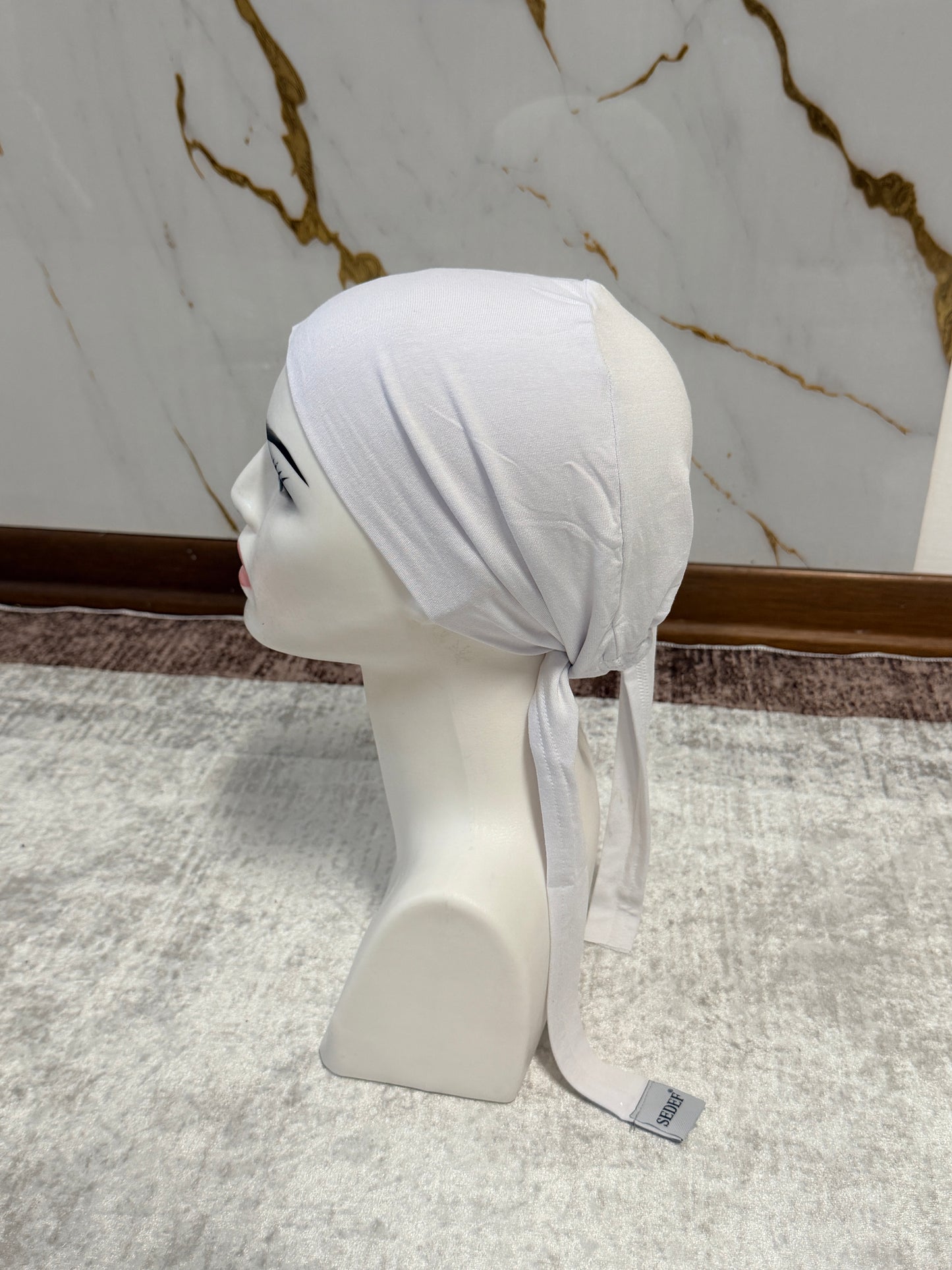 Cuffia con gomma sotto